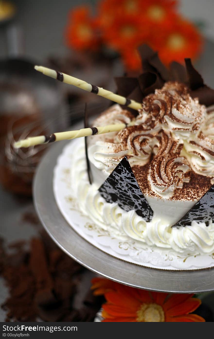 A Birthday Cake being decorated at the bakery. A Birthday Cake being decorated at the bakery