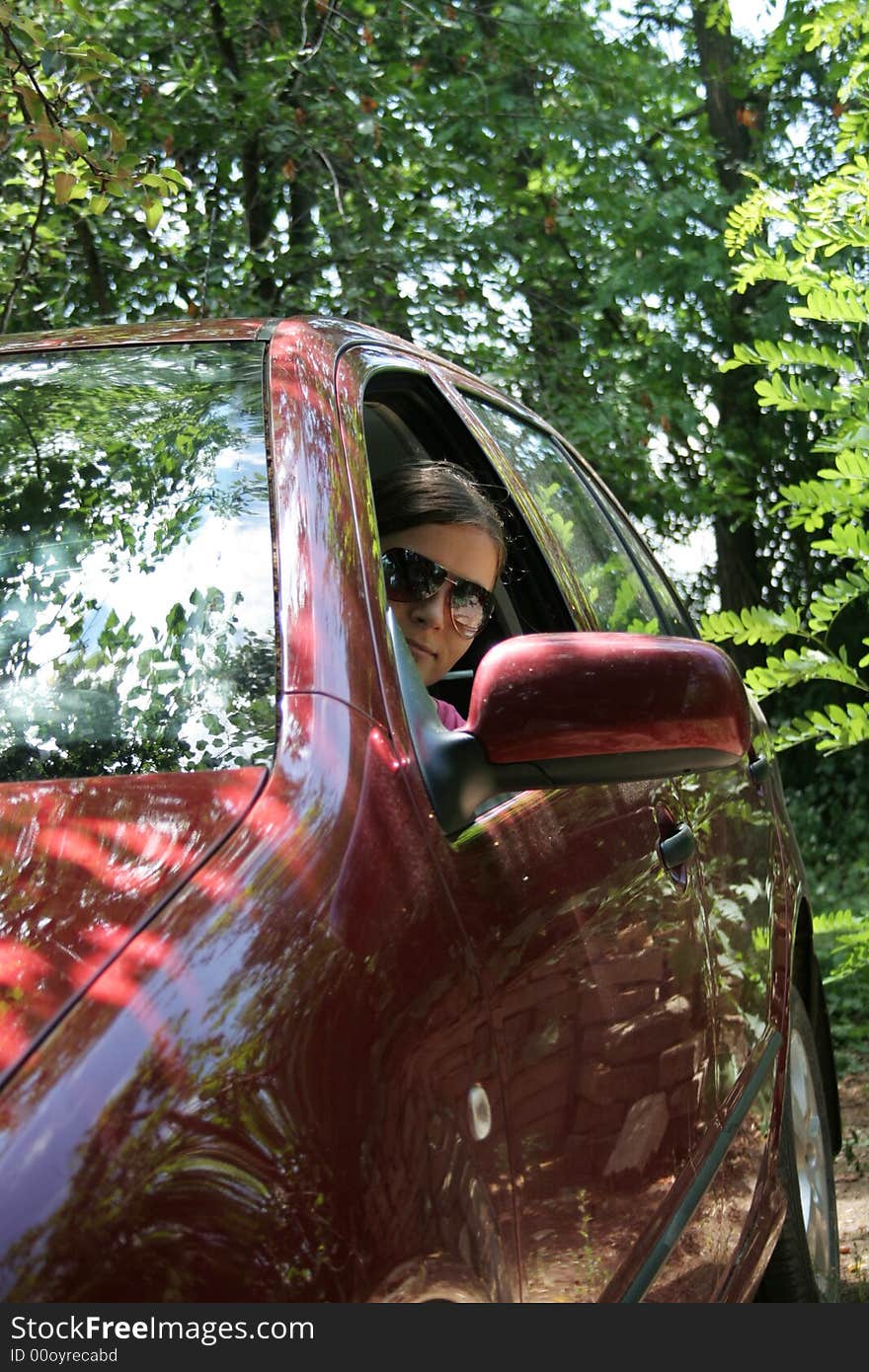 Young Woman In A red Car. Young Woman In A red Car