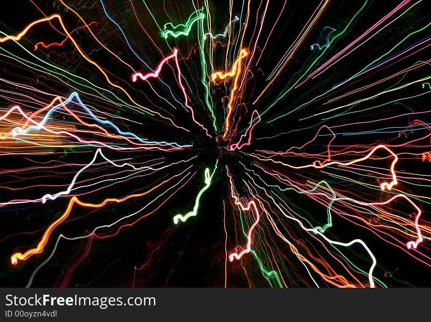 Multicolor abstract light tracks against black background