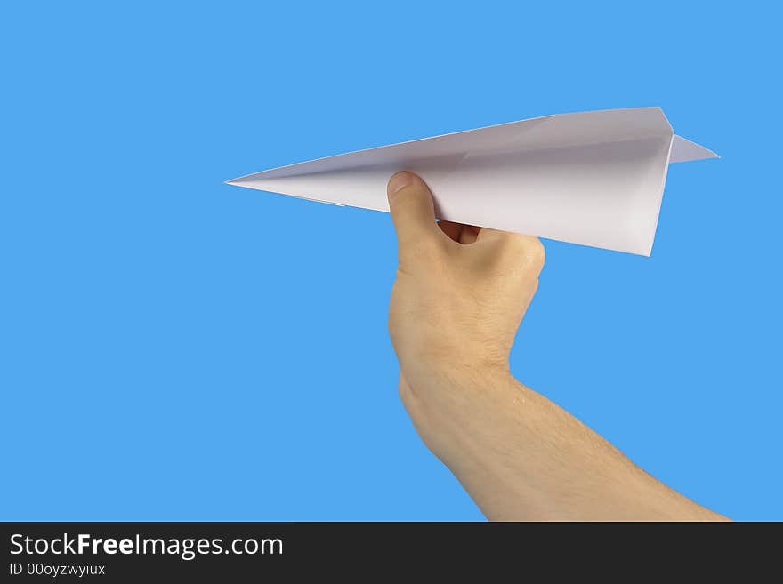 The Hand, keeping paper plane, on turn blue the background. The Hand, keeping paper plane, on turn blue the background.