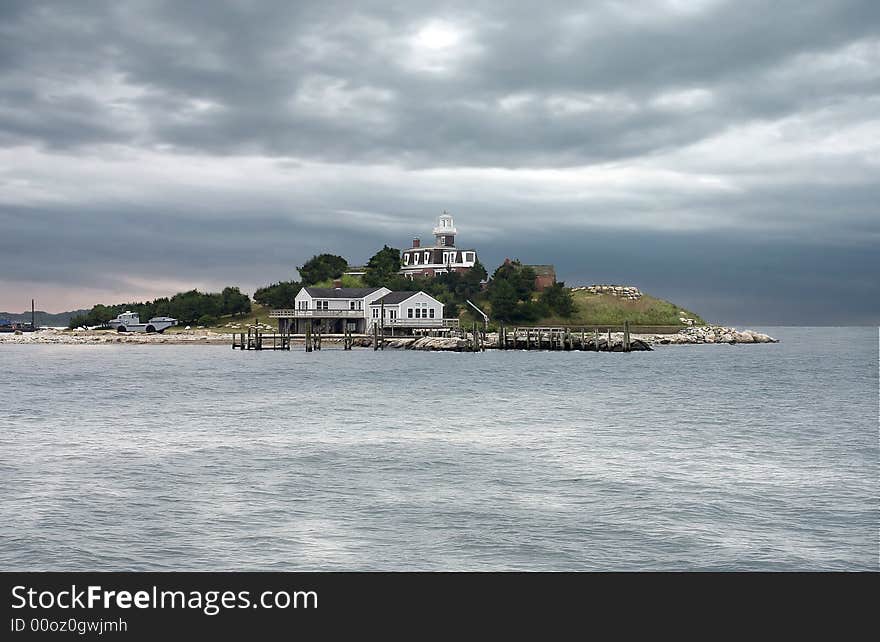 A lighthouse is located on a island, although the lighthouse is no longer in use it makes a nice picture. A lighthouse is located on a island, although the lighthouse is no longer in use it makes a nice picture