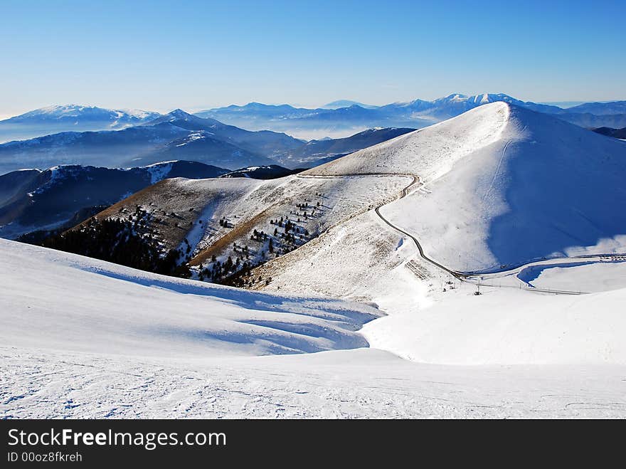 Majestic mountain peaks and ski slopes. Majestic mountain peaks and ski slopes