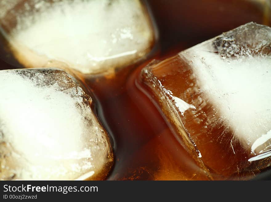 Ice cubes soaked in cold whisky drink