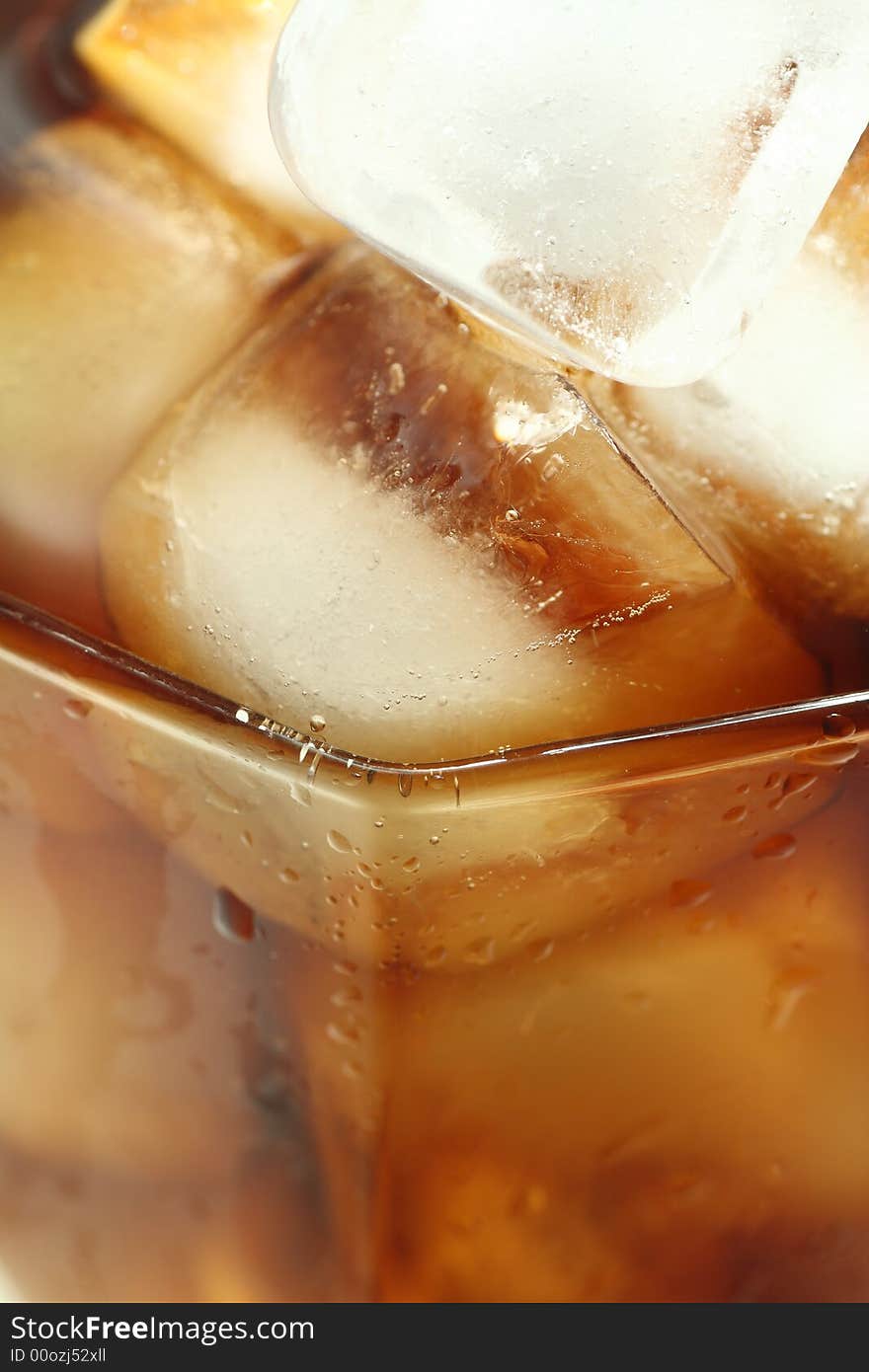 Ice cubes soaked in cold whisky drink