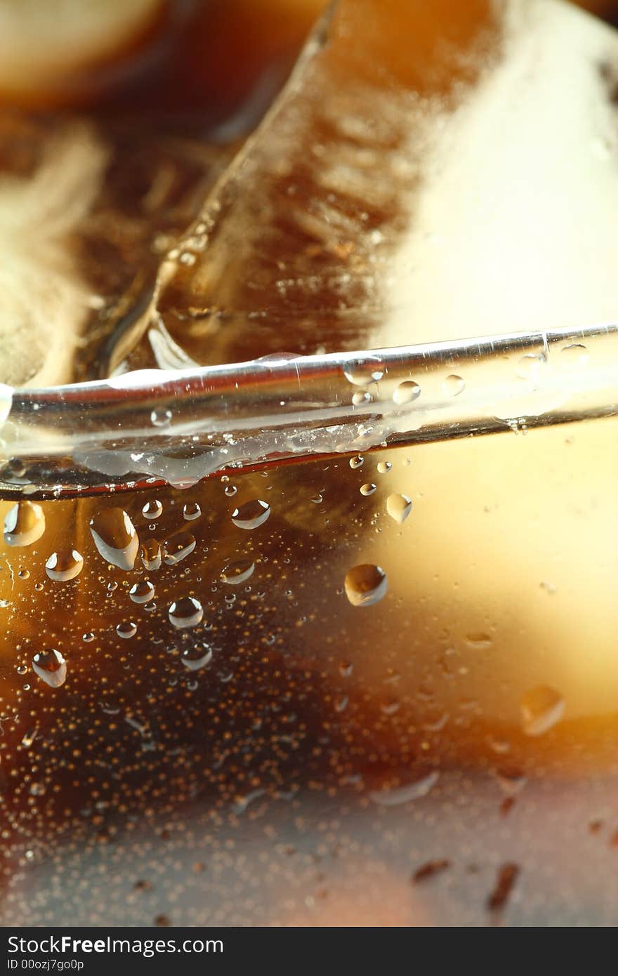 Ice cubes soaked in cold whisky drink