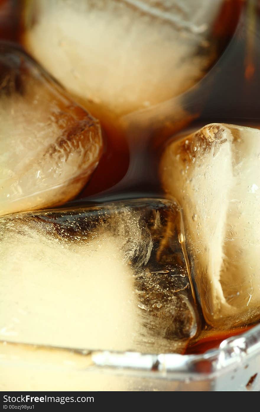 Ice cubes soaked in cold whisky drink