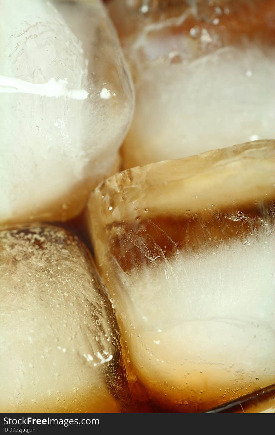 Ice cubes soaked in cold whisky drink