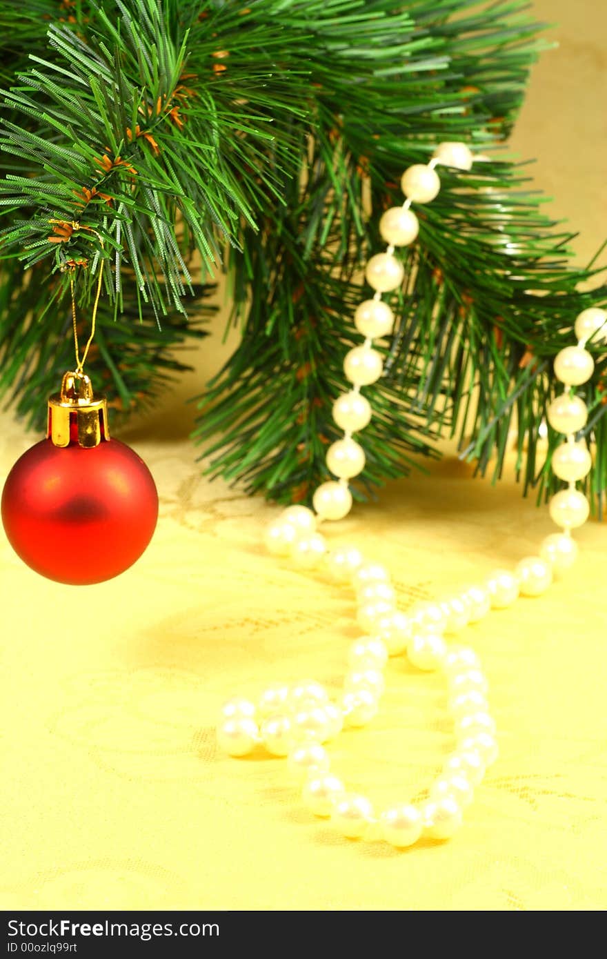 Christmas red ball with tree and pearl on the table