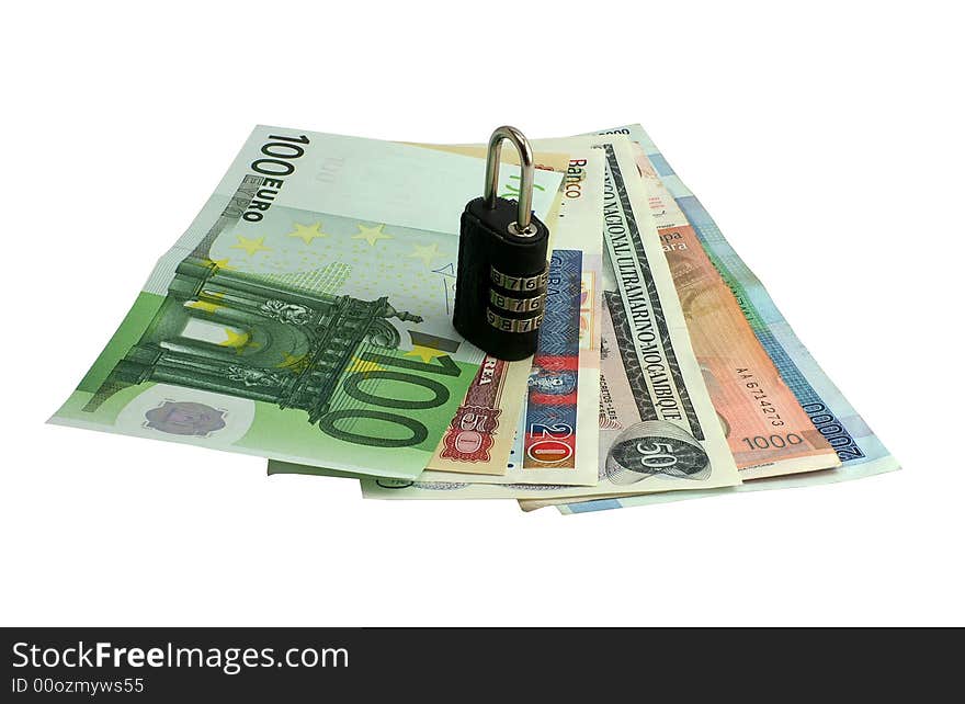 Money from different countries with a lock. Money from different countries with a lock