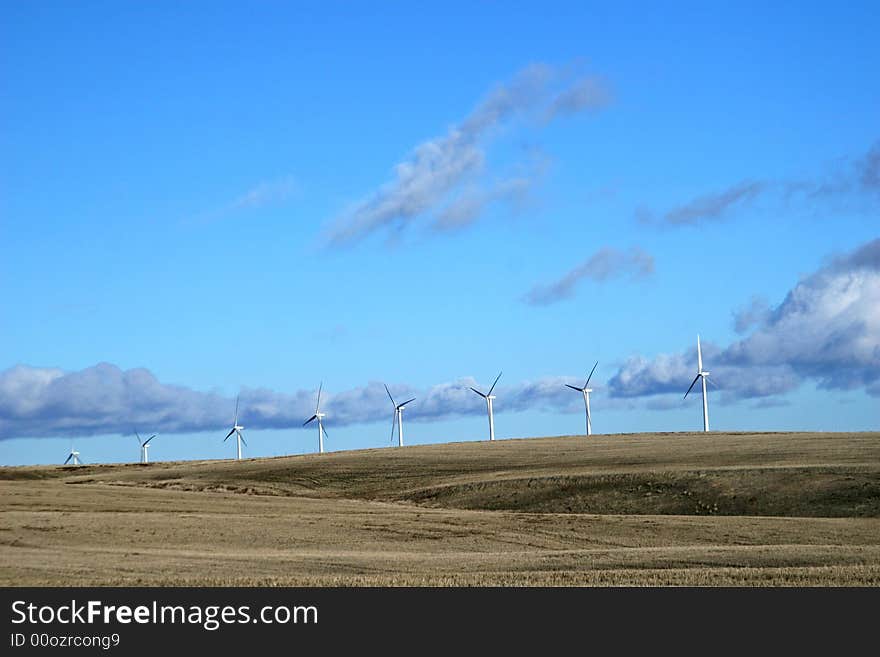 A line of windmills on a distant hill