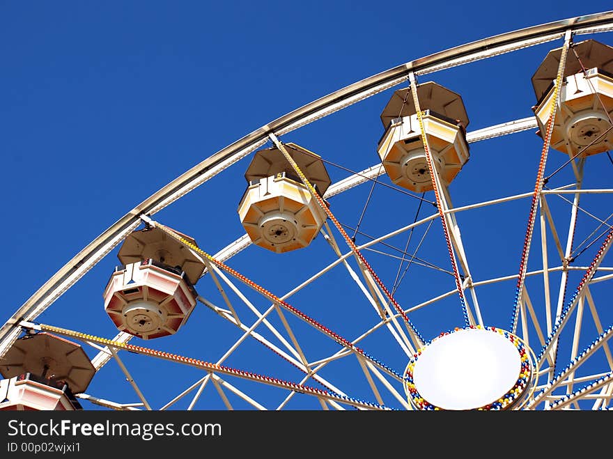 Large ferris wheel in Chicago on the blue sky.