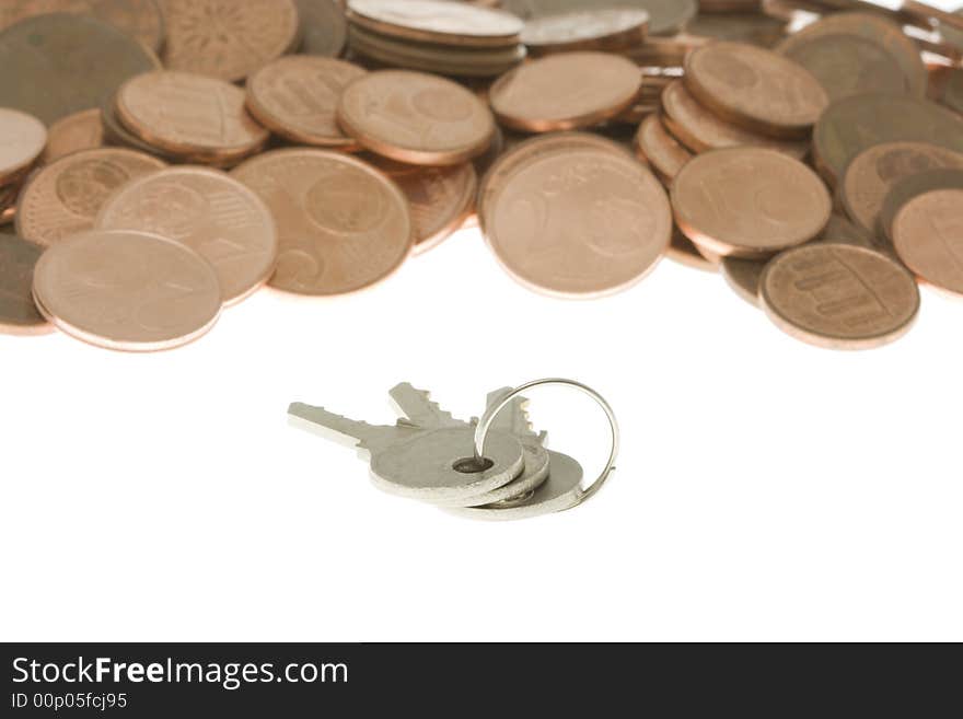 Bunch of keys in front of pile of cents