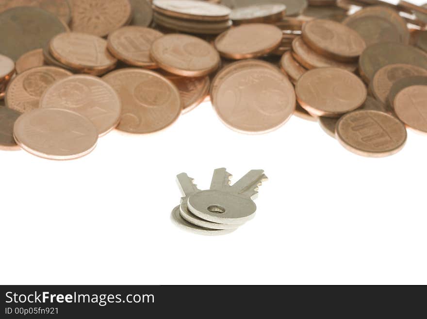 Bunch of keys in front of pile of cents