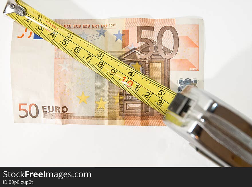 Yellow measuring tape and Euro money. Conceptual to success. Yellow measuring tape and Euro money. Conceptual to success