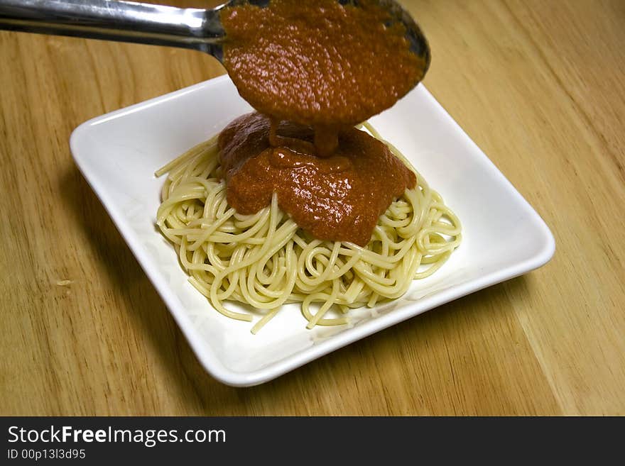 Serving pasta noodles on a white plate. Serving pasta noodles on a white plate.