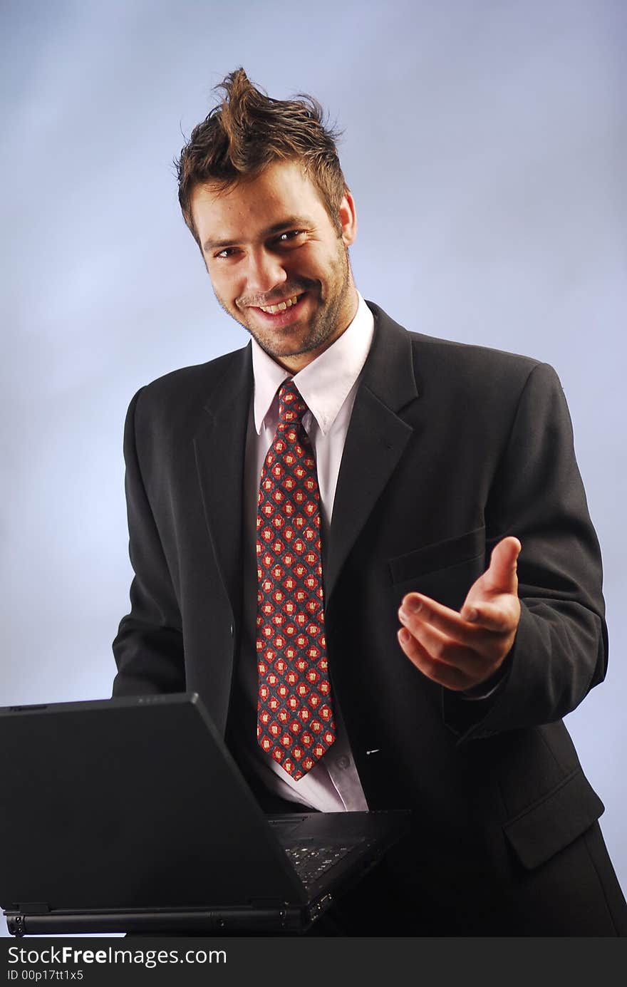 An elegant businessman with his notebook. An elegant businessman with his notebook