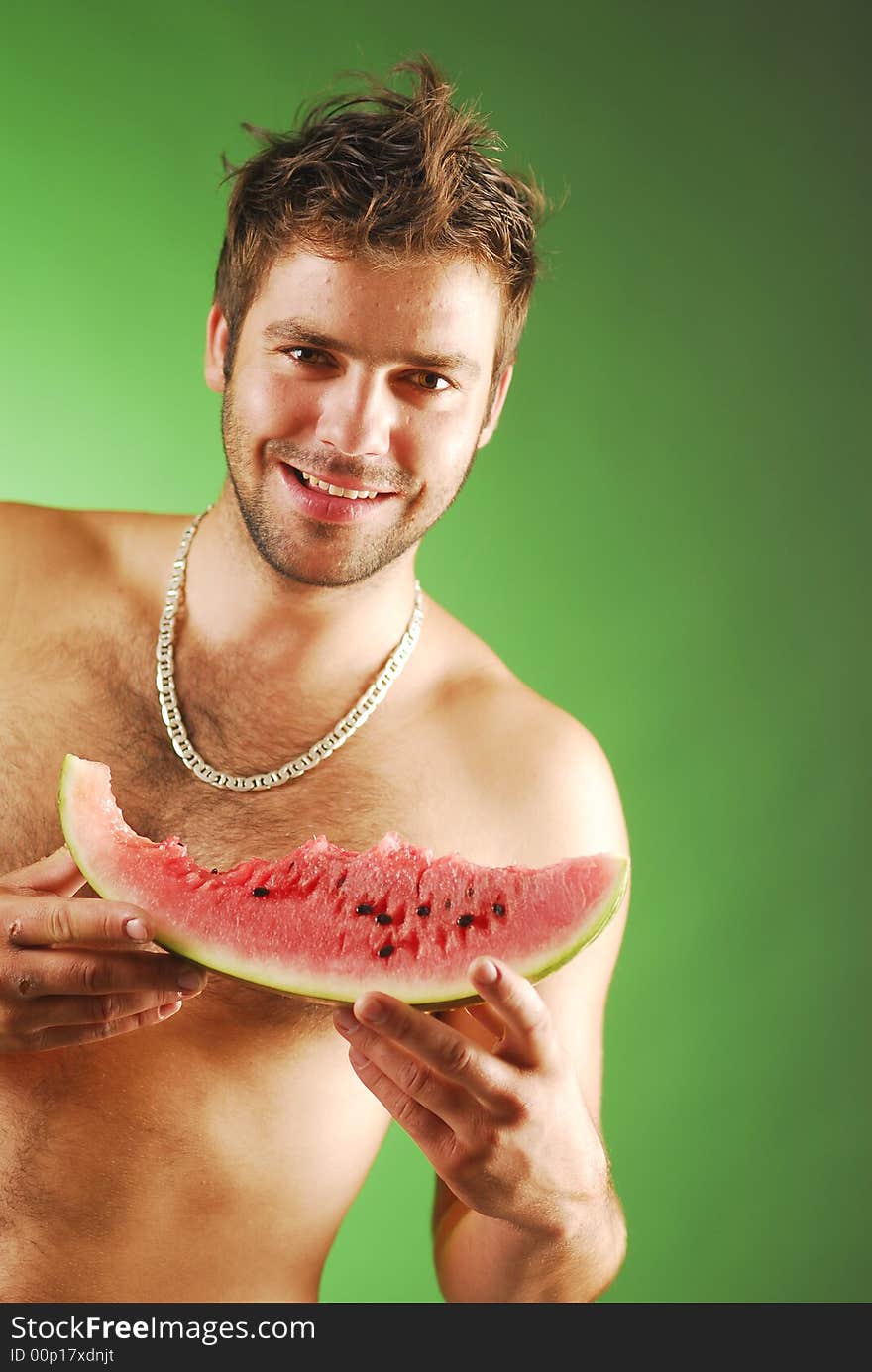 Undressed man with a watermelon