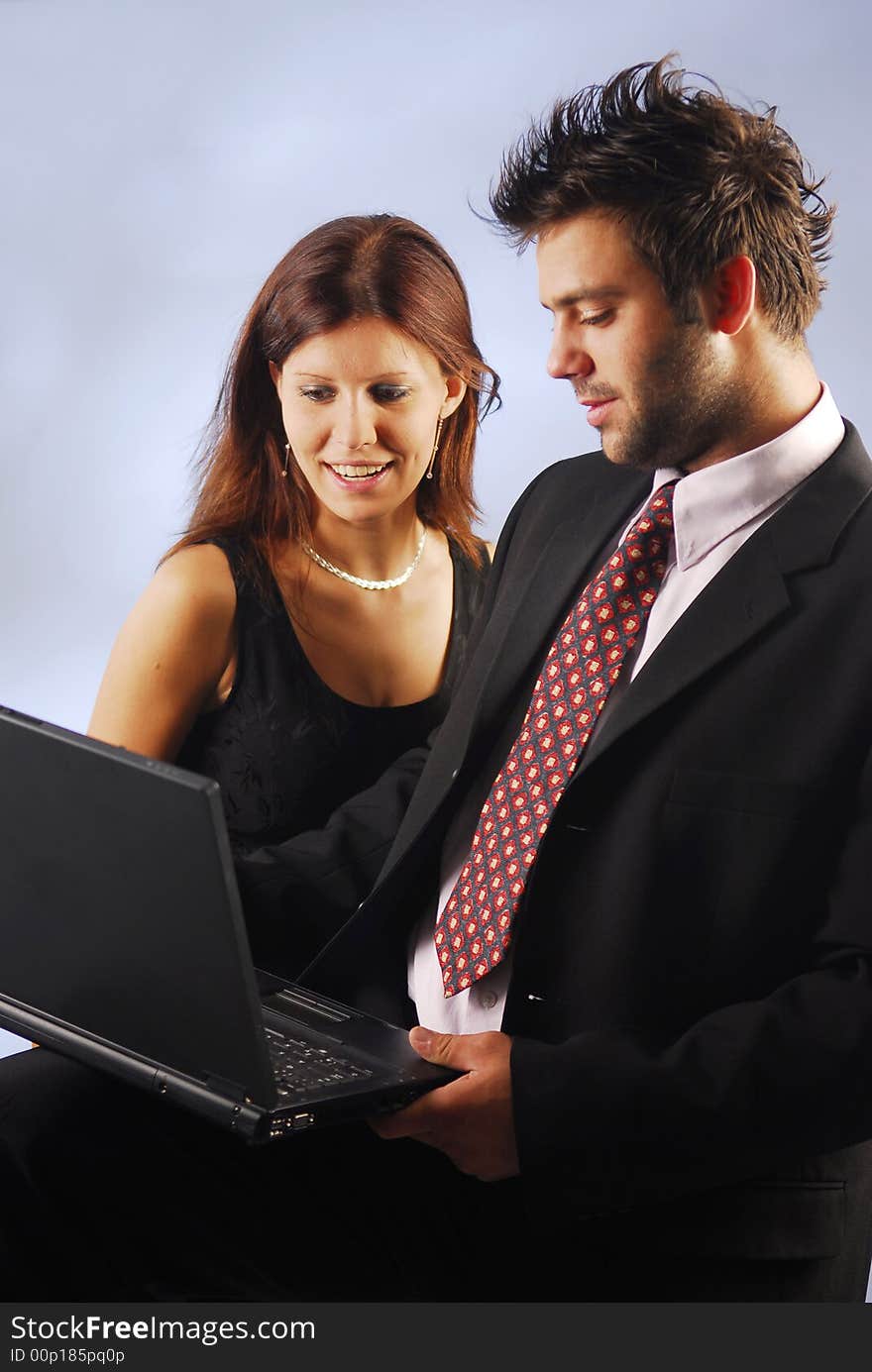 A man showing off his work to his colleague. A man showing off his work to his colleague