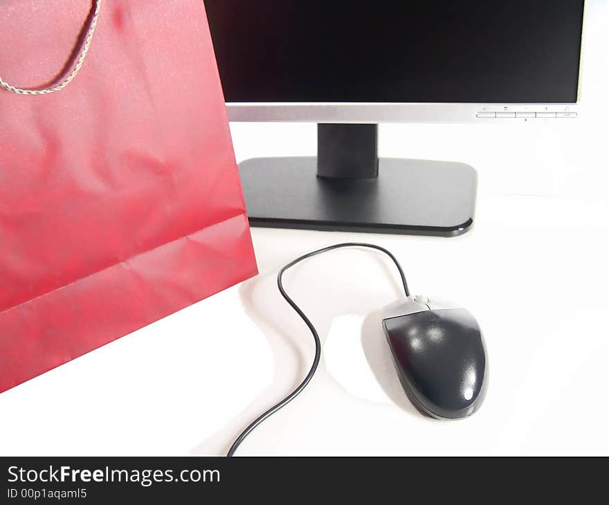 Wide Screen LCD Computer Monitor, Mouse and Gift bag (Isolated on white background). Wide Screen LCD Computer Monitor, Mouse and Gift bag (Isolated on white background)