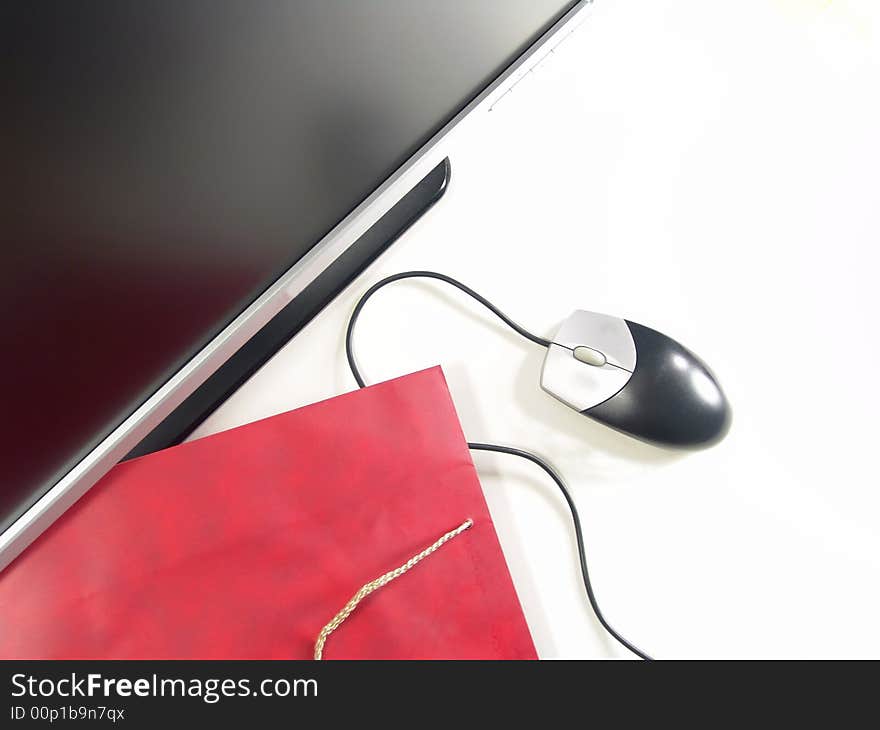 Wide Screen LCD Computer Monitor, Mouse and Gift bag (Isolated on white background). Wide Screen LCD Computer Monitor, Mouse and Gift bag (Isolated on white background)