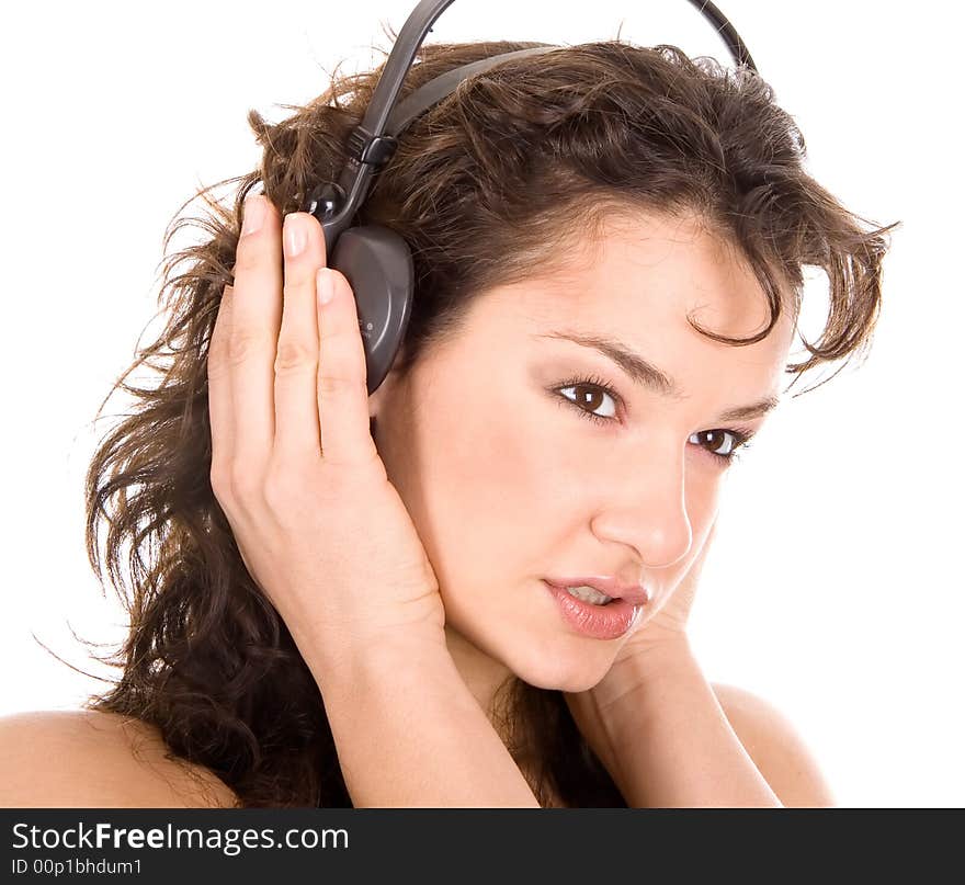 Beautiful young girl listening a music on a headphones