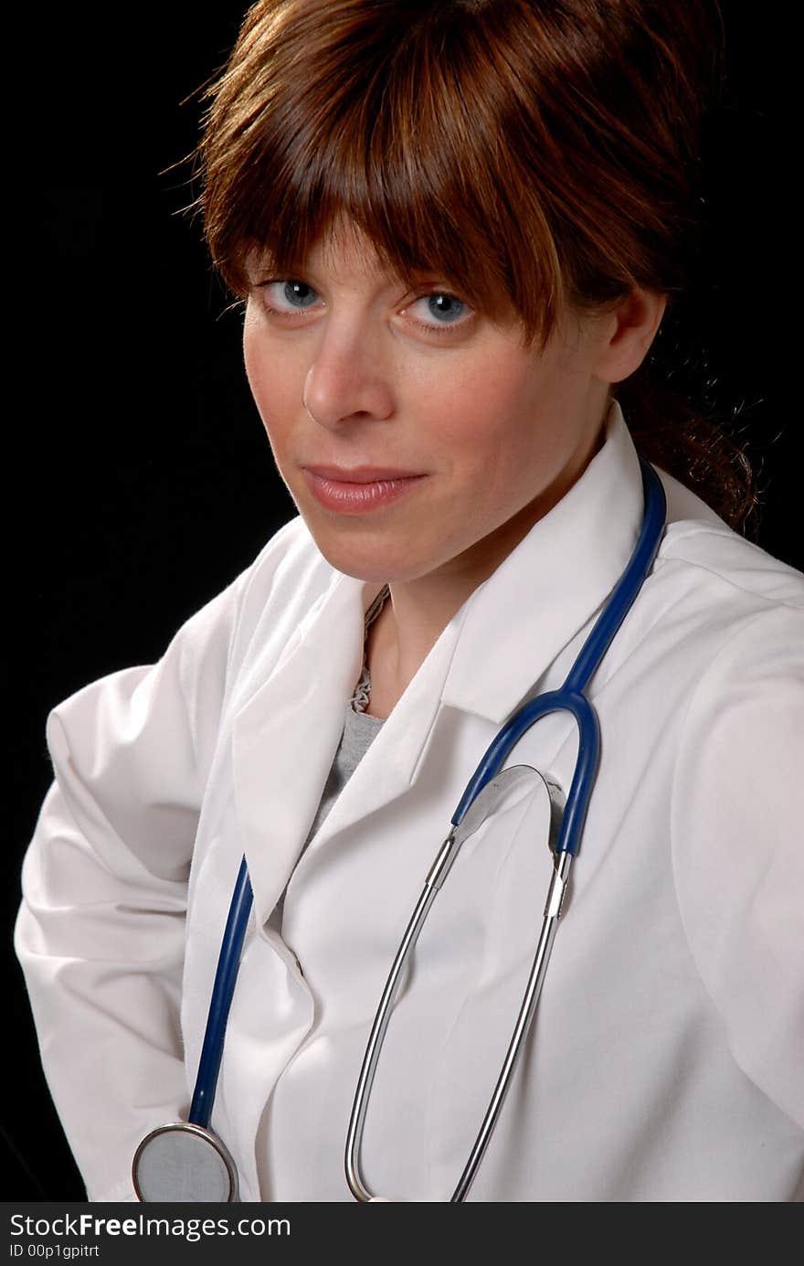 Cute young lady doctor with stethoscope, on black. Cute young lady doctor with stethoscope, on black