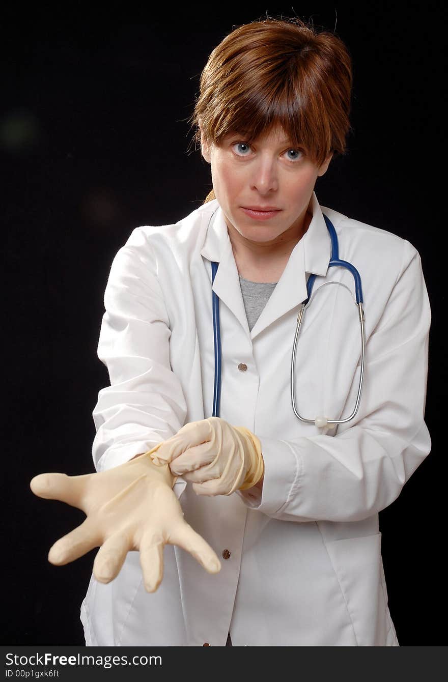 Nurse Putting On Latex Gloves