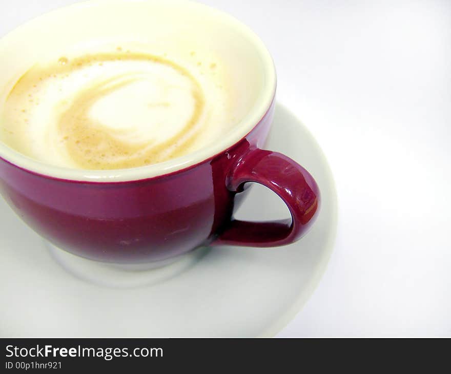 Close up shot of violet cup on white background. Close up shot of violet cup on white background.