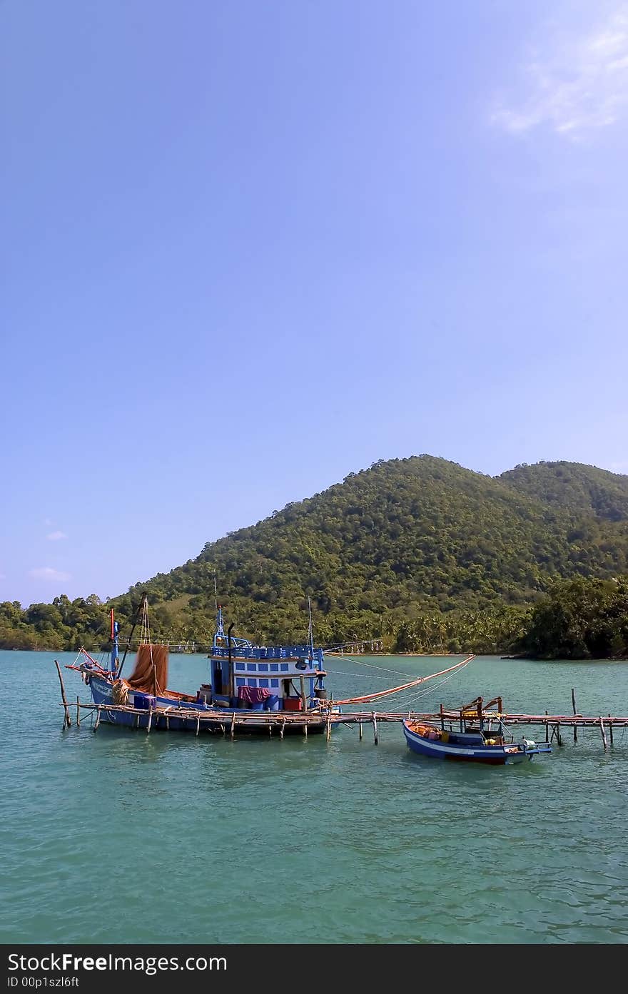 Colourful boat and pier on a small island. Colourful boat and pier on a small island