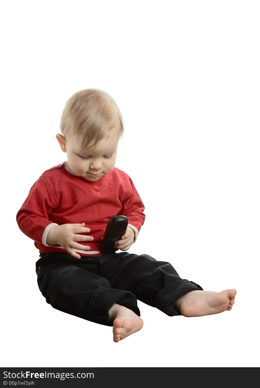 Barefoot baby in a red shirt with phone  isolated on a white background. Barefoot baby in a red shirt with phone  isolated on a white background