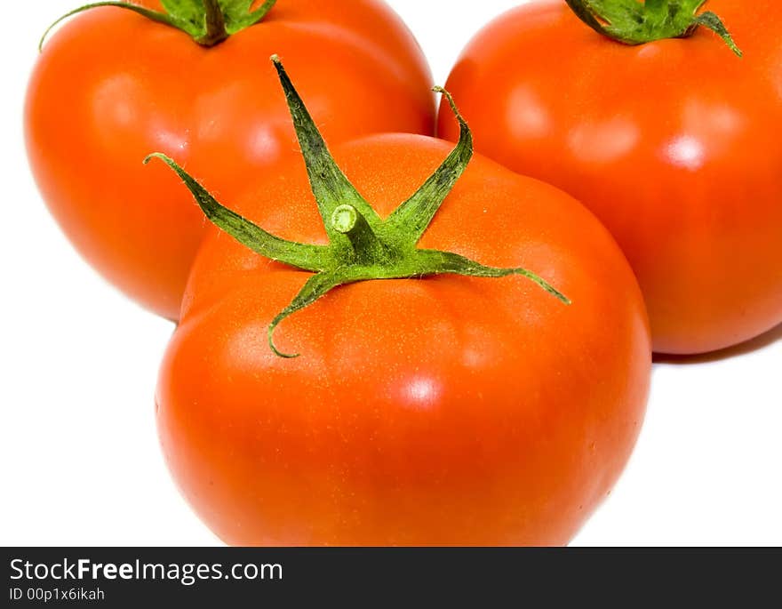 Three tomatoes isolated