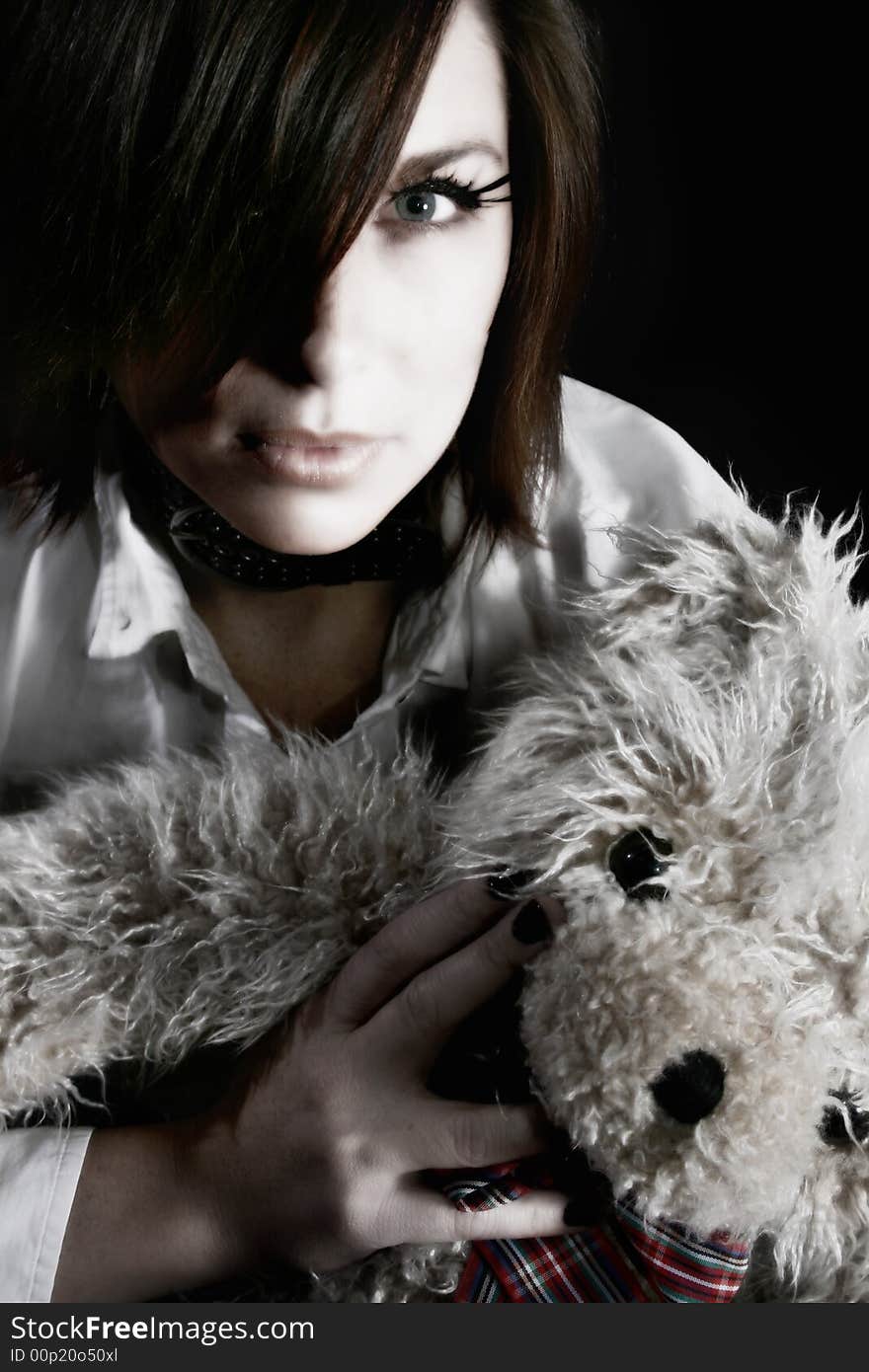 A woman holding a teddy bear