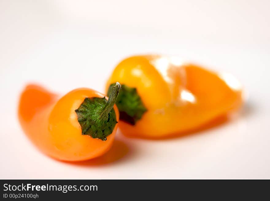 Sweet Orange Peppers on a white background.