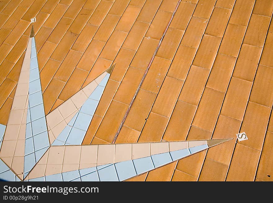 Detail of a colorful pavement compass rose