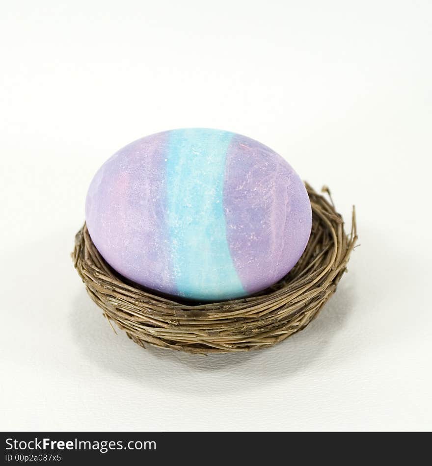 Blue and purple striped, dyed Easter egg. Blue and purple striped, dyed Easter egg.