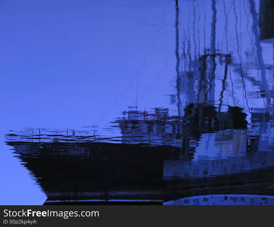 A reflection of a fishing boat docked and ready to go. A reflection of a fishing boat docked and ready to go.