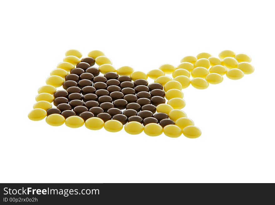 Arrow-like heap of pills isolated on white