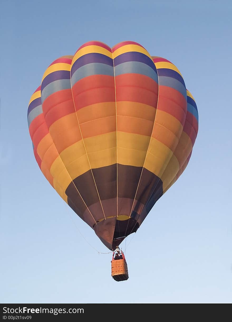 Colourful hot-air balloon on a blue sky background