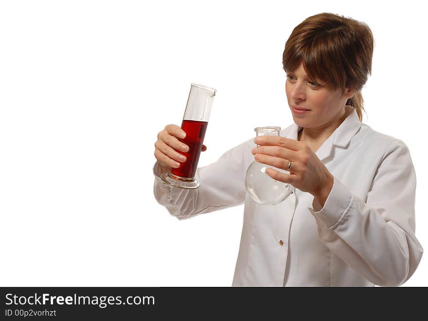 Cute young lady scientist in white coat, holding flask and red liquid, isolated on white