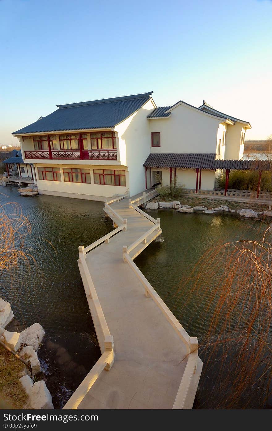 The winding bridge and house of Chinese gardens. The winding bridge and house of Chinese gardens