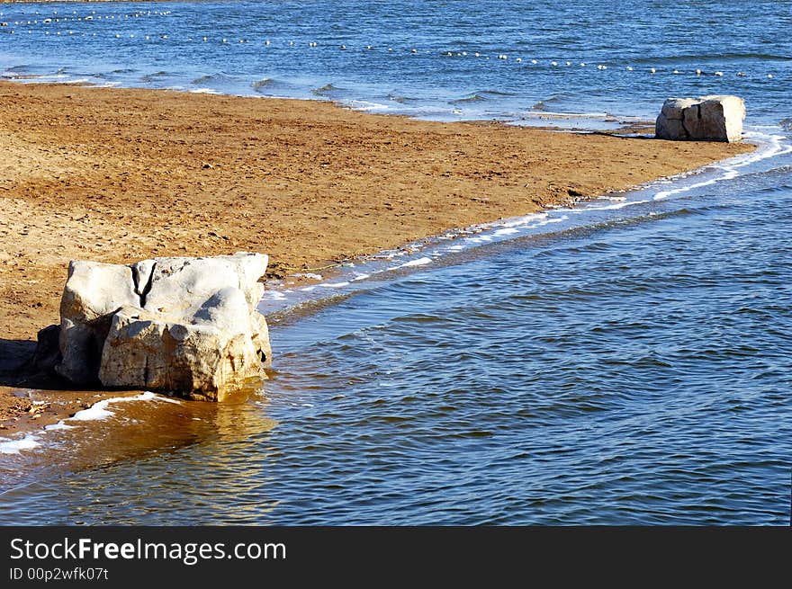 Winter lake shore  in a garden