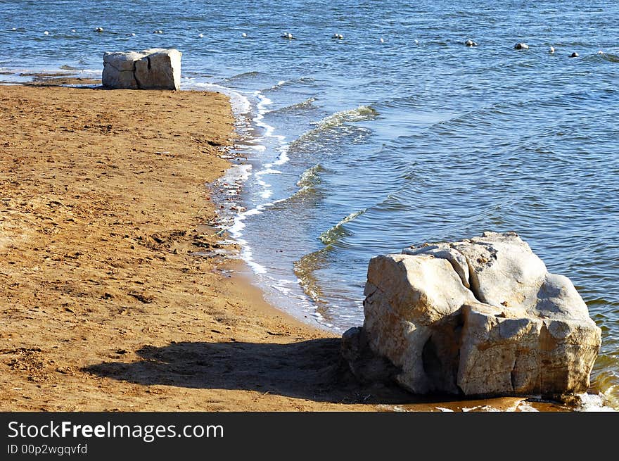 Winter lake shore  in a garden