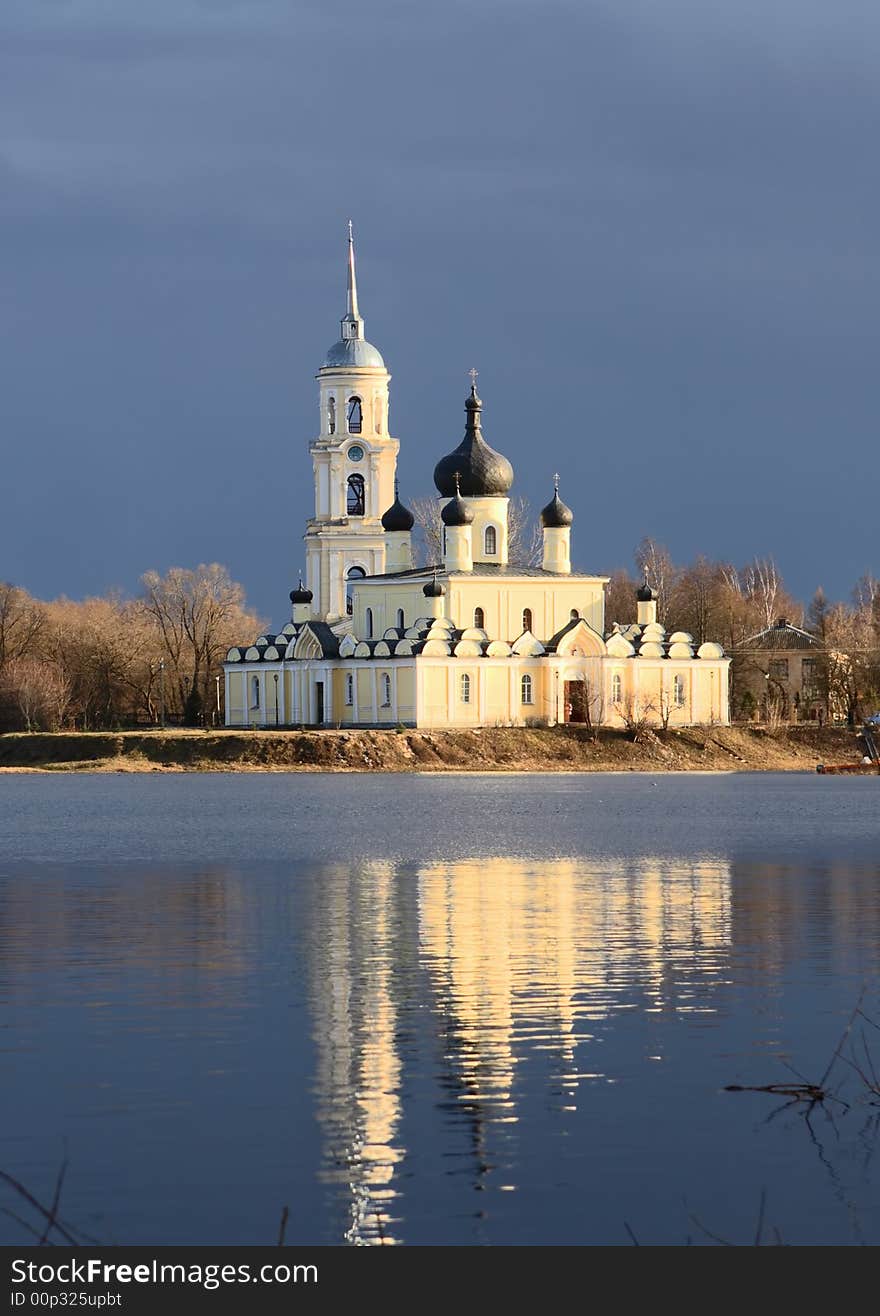 Orthodox church. River.Blue sky