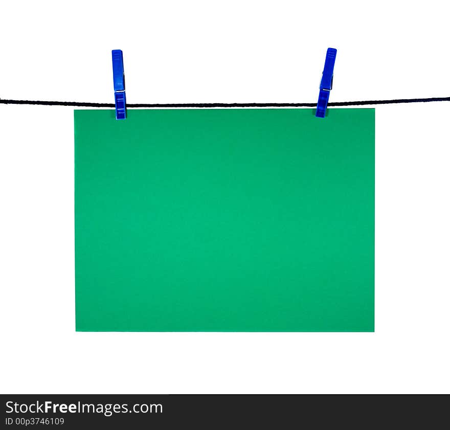 Green blank sheet on clothes-line for your notice, isolated on white