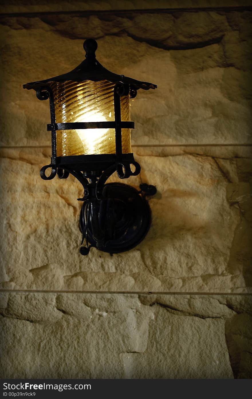 Antique sconce on old brick exterior wall