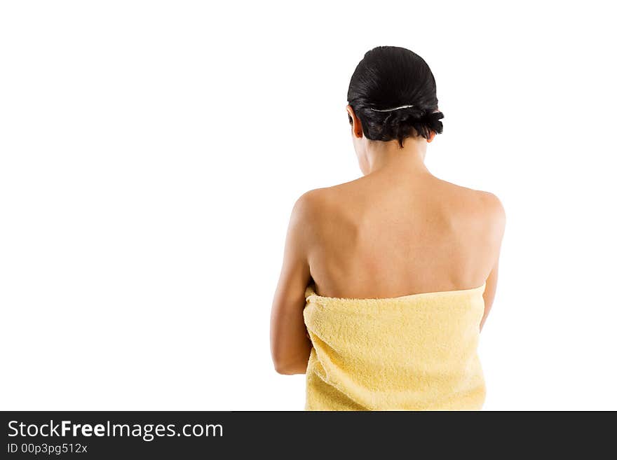 Woman wrapped into towel from behind. Isolated on white. Woman wrapped into towel from behind. Isolated on white.