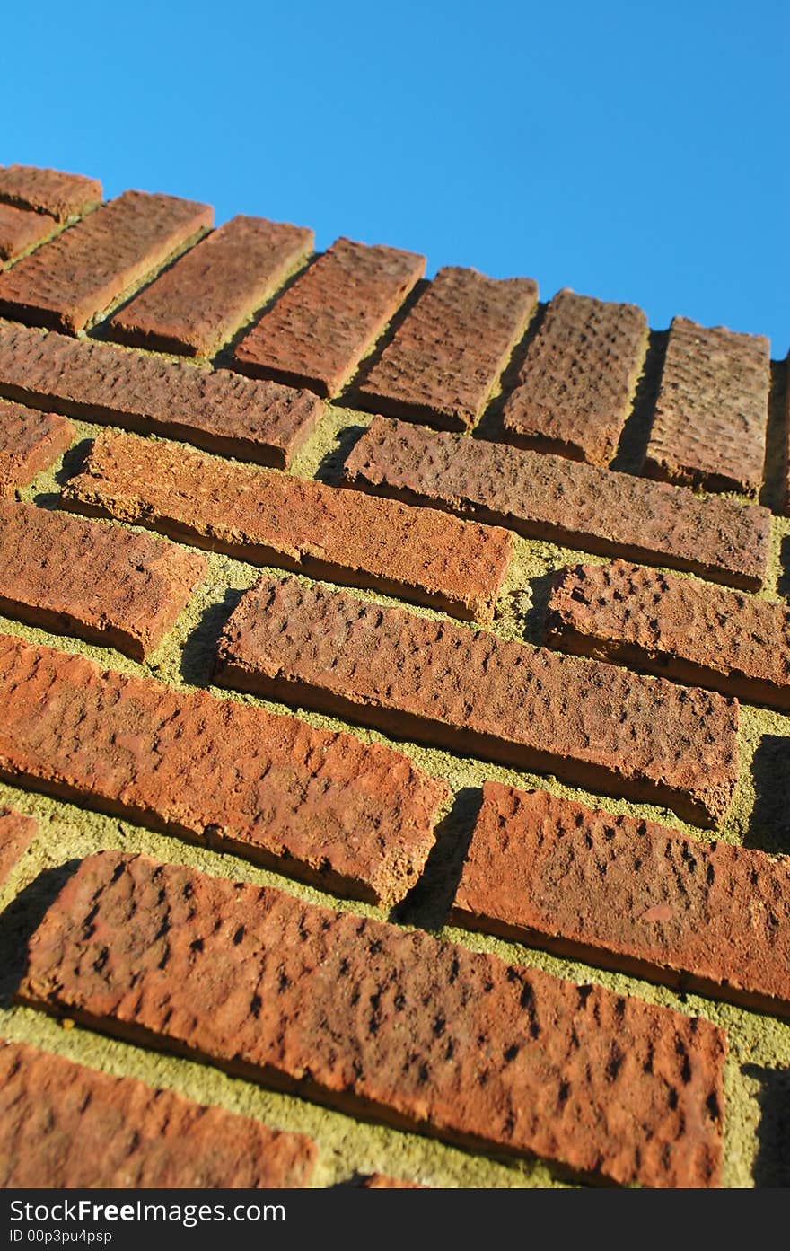 Red brick wall abstract with deep shadows