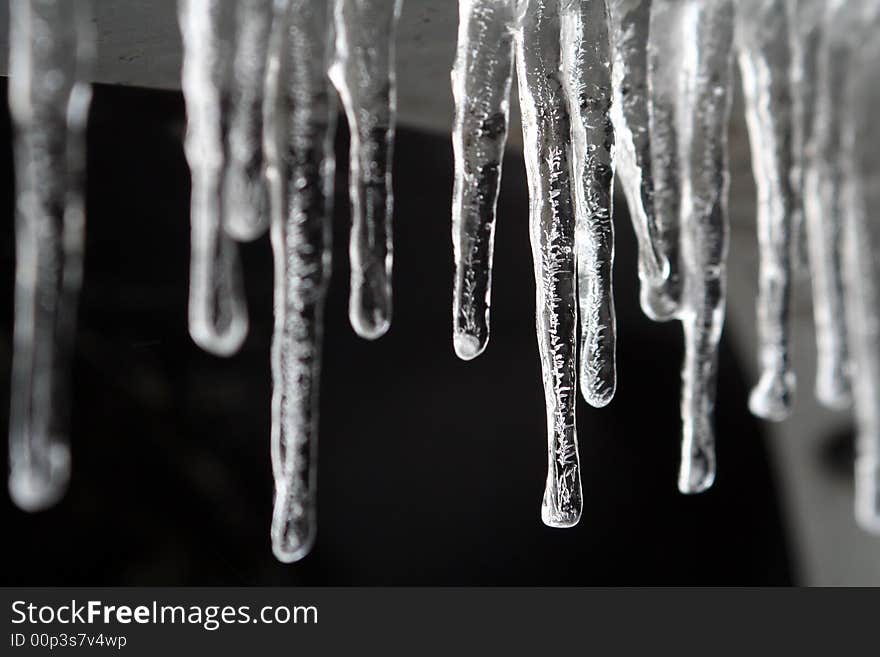 Detail of icicles with the center focused and the left and right blurred.