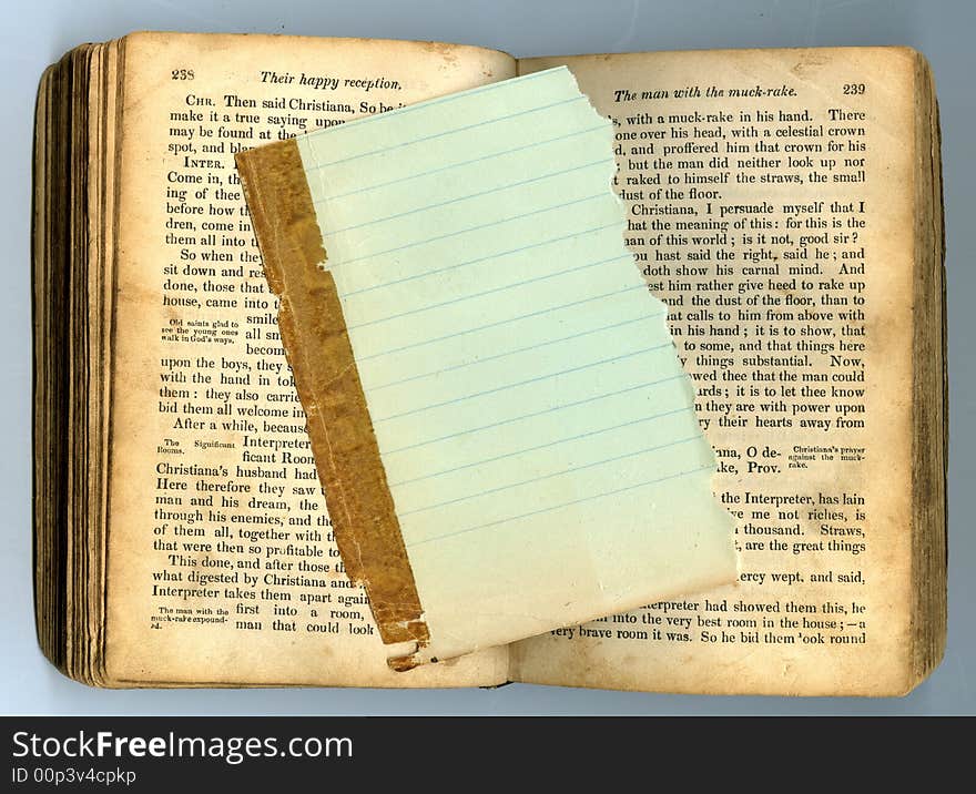 Lined paper on antique book opened