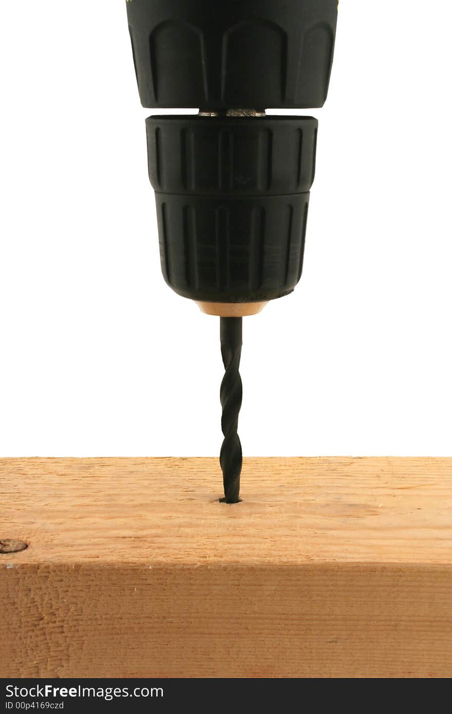 A isolated Cordless drill drilling into wood